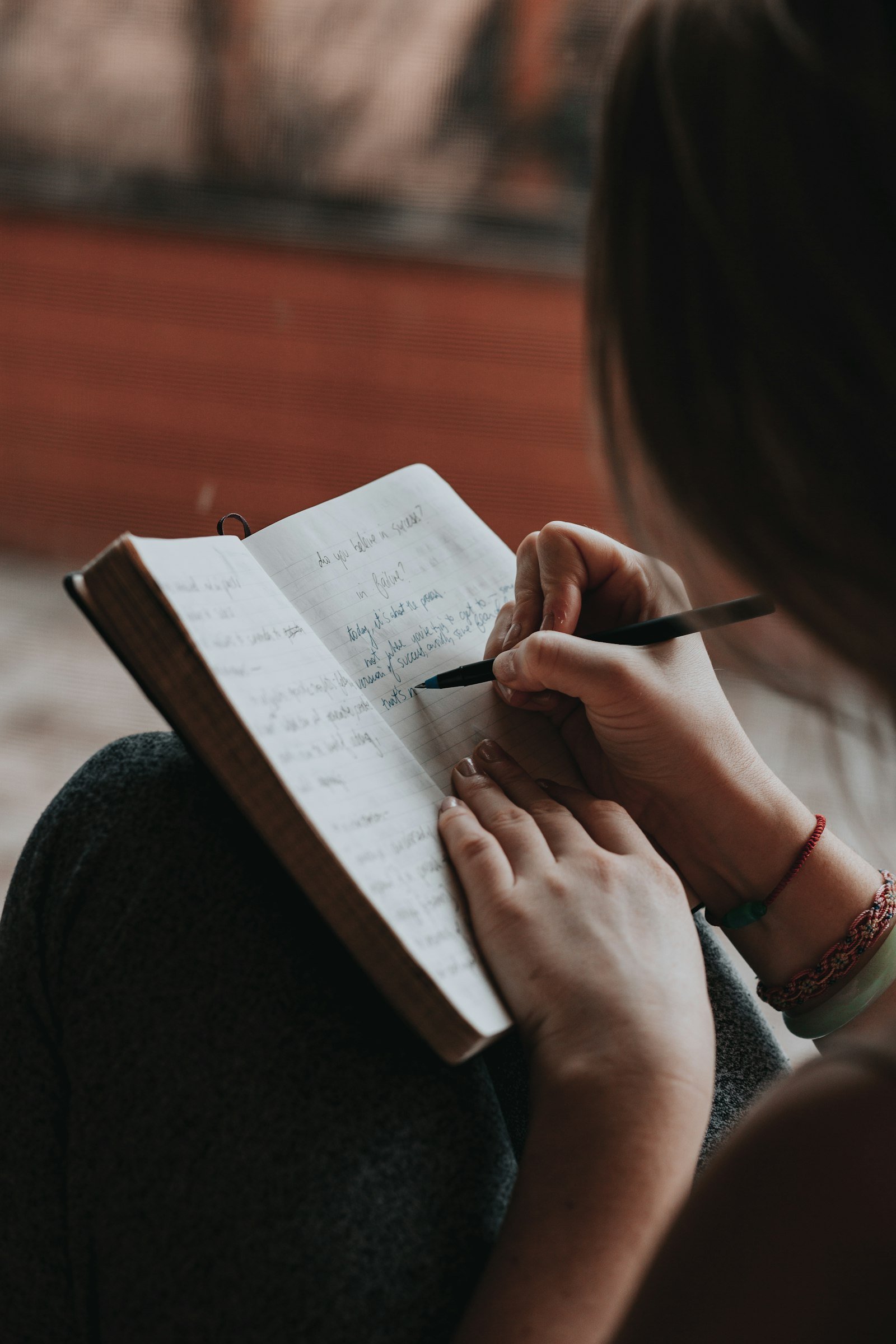 Woman writing in a notebook